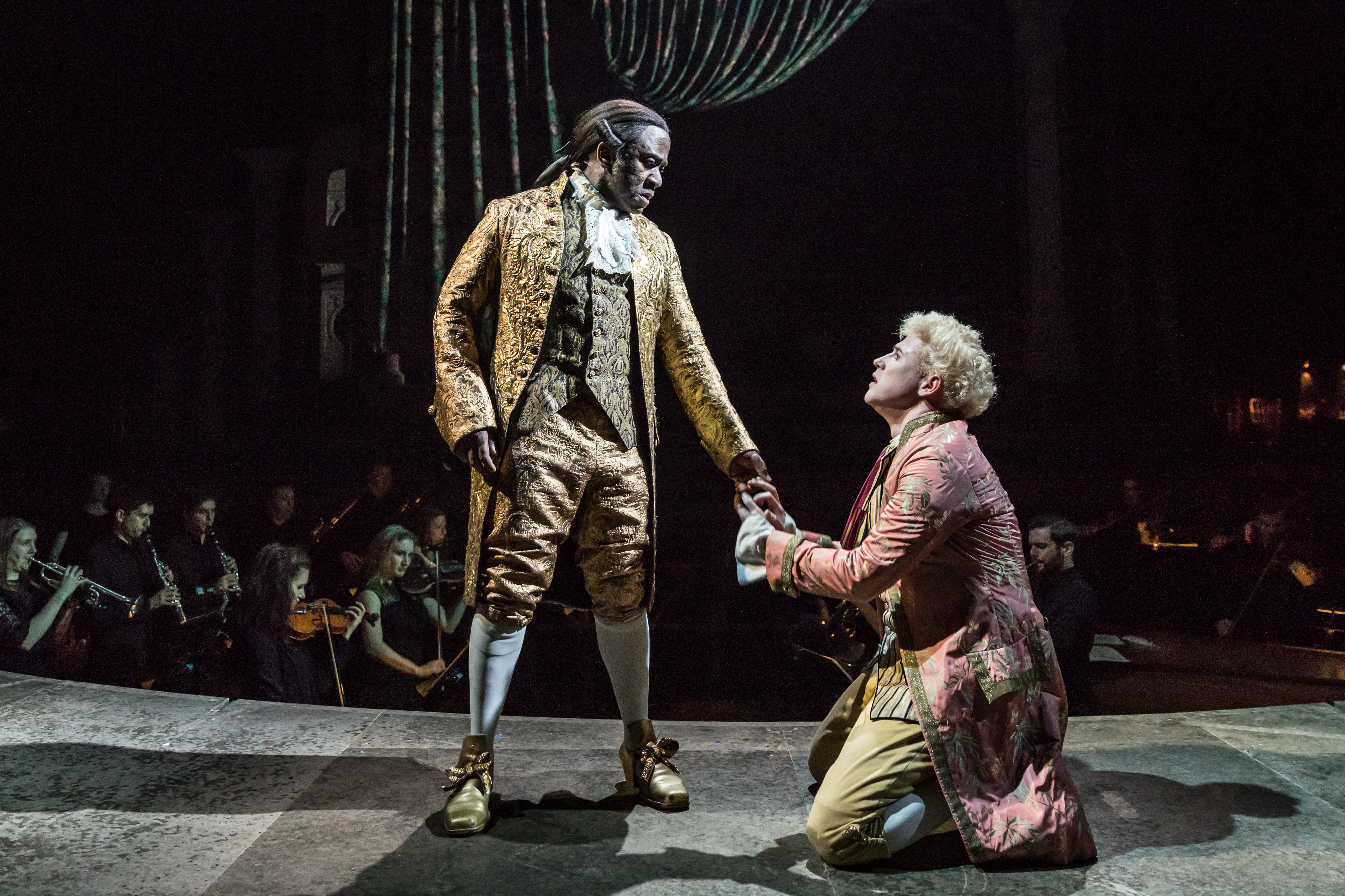 Lucian Msamati as Antonio Salieri and Adam Gillen as Wolfgang Mozart in Amadeus at the National Theatre (c) Marc Brenner