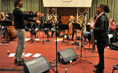 Conductor Jules Buckley, members of the BBC Symphony Orchestra and Ms Dynamite [image credit Mark Allen]