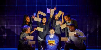 The Curious Incident of the Dog in the Night-time – review Connor Curren (Christopher) and the company of 'The Curious Incident of the Dog in the Night-Time'. Photo credit Brinkhoff-Moegenburg .