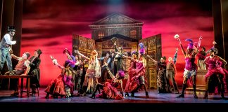 My Fair Lady – review Stephen K Amos as Alfred P Doolittle with the company of My Fair Lady. Credit Marc Brenner