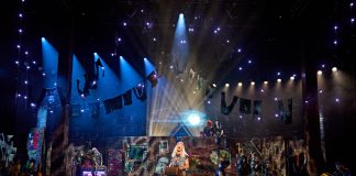 We Will Rock You – review Ben Elton as Rebel Leader with We Will Rock You cast Photo Credit Manuel Harlan