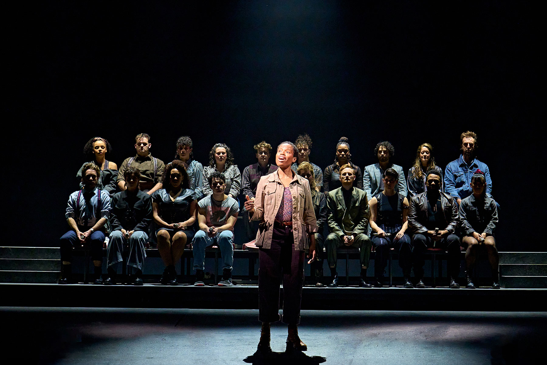 Abiona Omonua (Amara) and the Company in Just For One Day at The Old Vic