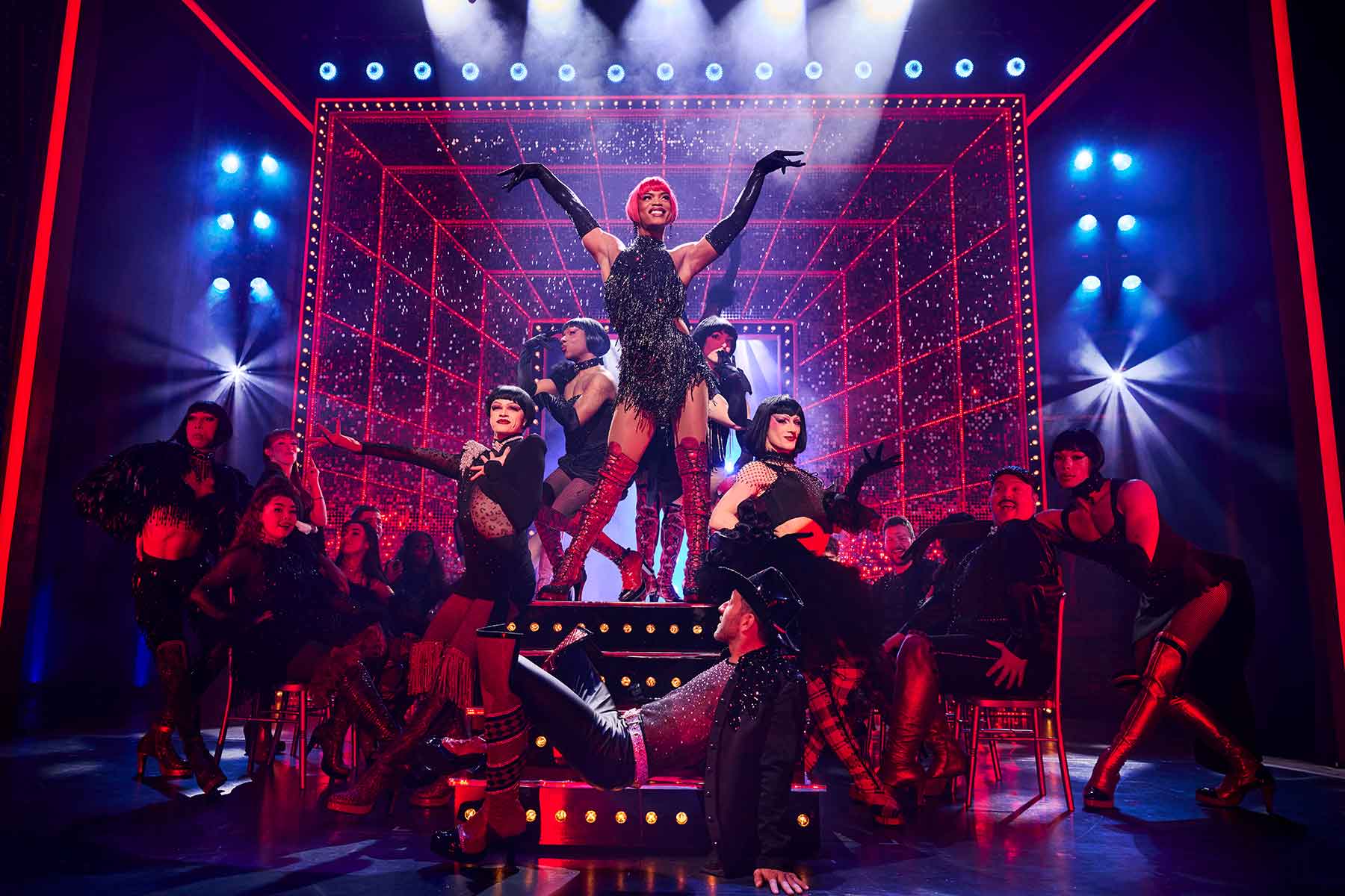 Johannes Radebe as Lola (centre top), Matt Cardle as Charlie Price (centre bottom) & the cast of KINKY BOOTS THE MUSICAL, credit Matt Crockett