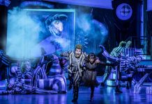 Beetlejuice the Musical – review David Fynn as Beetlejuice and Hannah Nordberg as Lydia Deetz with Company © Johan Persson