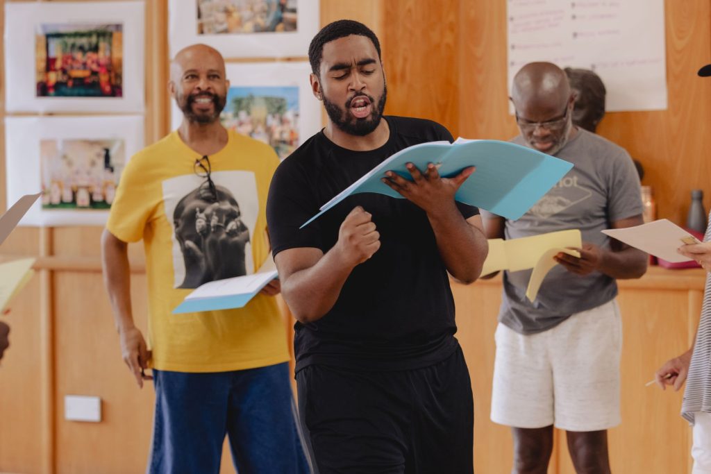 FIRST LOOK AT REHEARSALS FOR THE WORLD PREMIERE OF TARTUFFE (REMIXED) STARRING MARK RYLANCE AT MARYLEBONE THEATRE 13 Centre foreground - Ivandro Da Cruz Leite as Sinclair